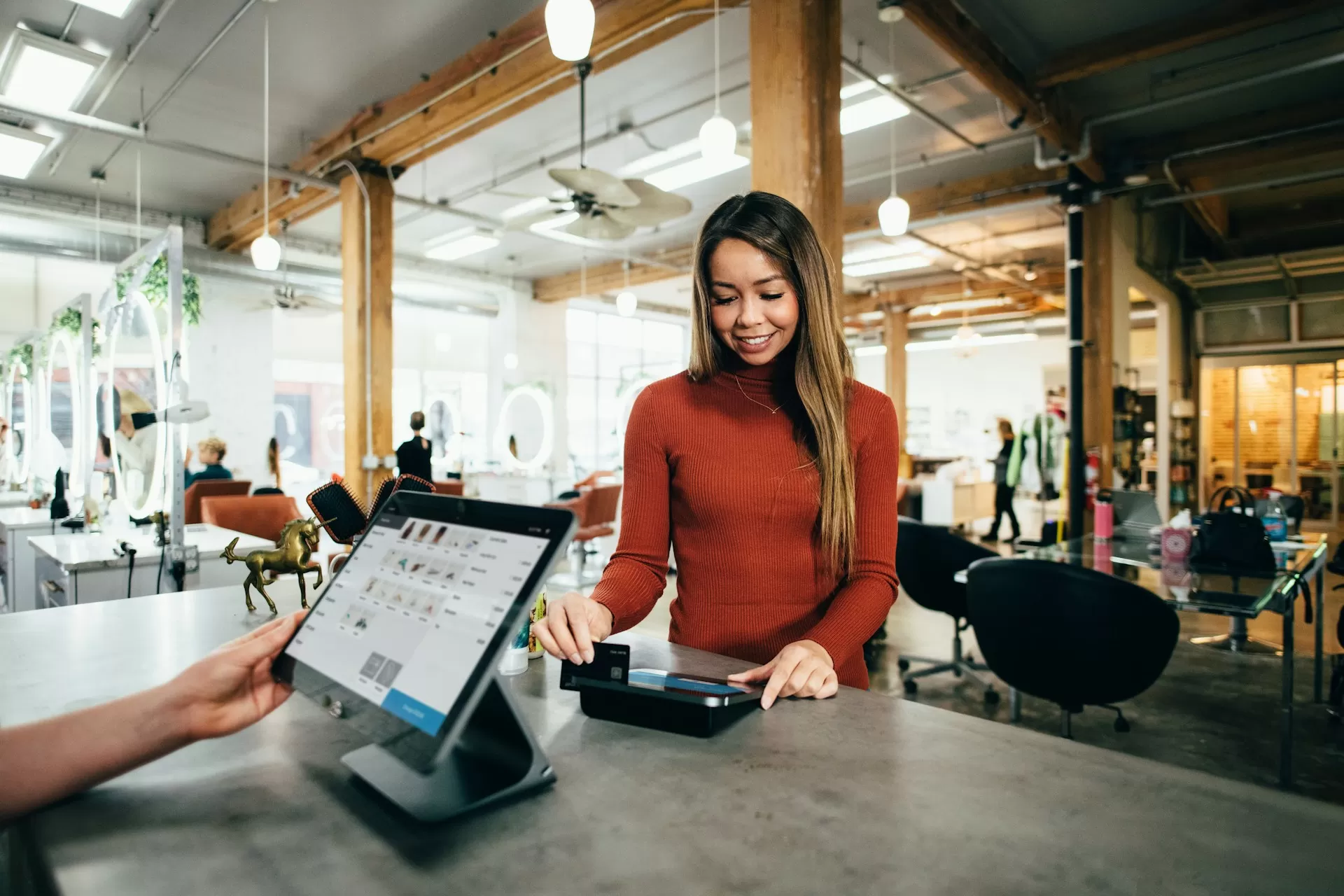 Woman Paying at cafe